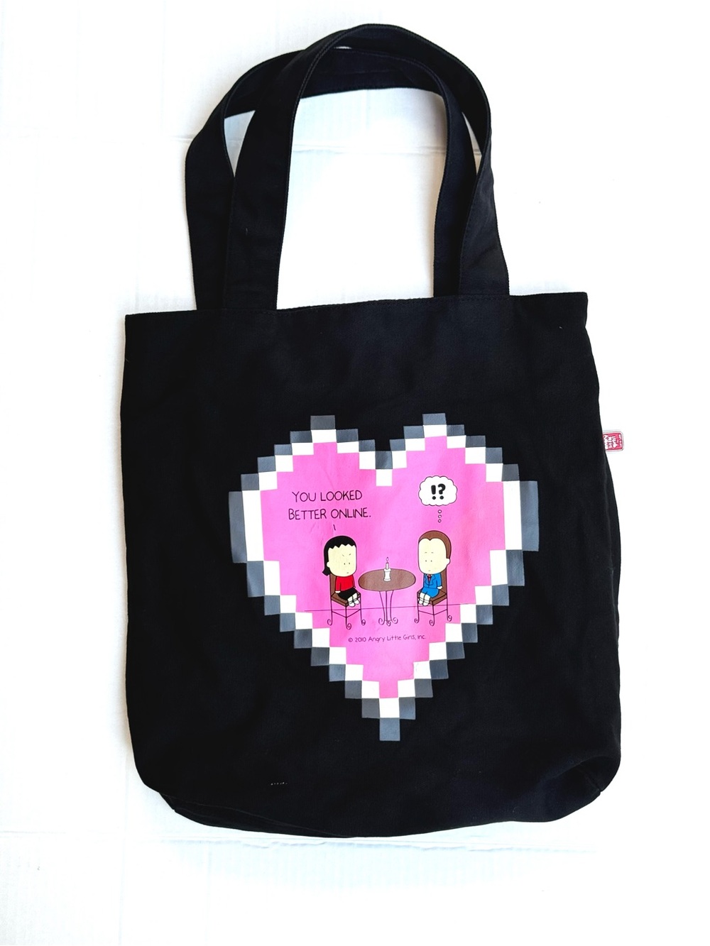 Angry Little Girls Black Tote with pixelated heart